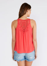 [Color: Hibiscus] A back facing image of a brunette model wearing a red bohemian tank top with a scooped neckline, spaghetti straps, and a sheer lace racerback detail. 