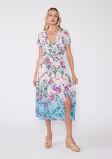 [Color: Light Pink/Purple} A vibrant floral midi dress perfect for vacation. Features a flattering v neckline with pleated details, short sleeves, adjustable waist belt, smocked back, and front slits.