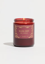 P.F. Candle in Silver Mist. A burgundy glass jar candle for the holidays.