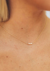 [Color: Gold] A delicate fourteen karat gold plated on sterling silver necklace with dainty freshwater pearls. Hypoallergenic and made in the USA.  
