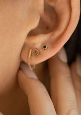 Dainty 18k gold plated bar stud earrings with a chain.