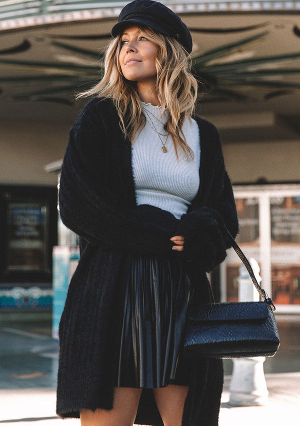 [Color: Black] Soft and super cute fuzzy long cardigan sweater with ribbed details and side pockets.