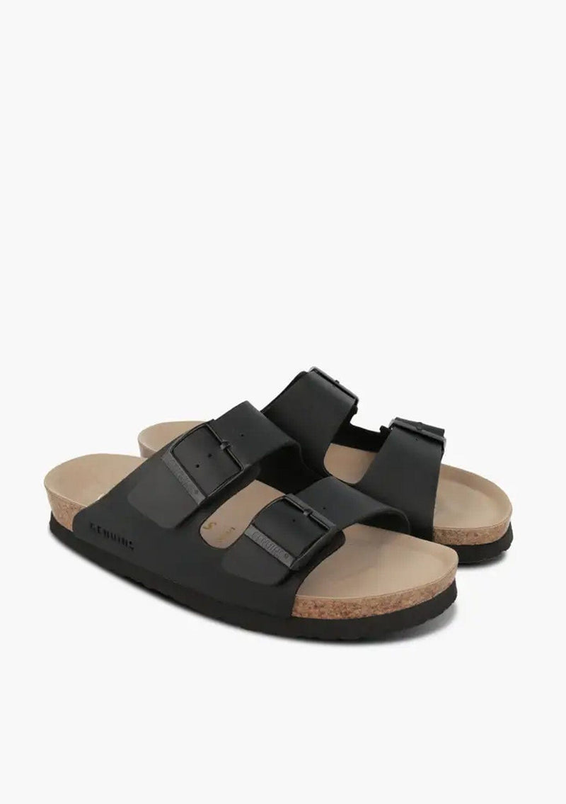[Color: Black] Black vegan leather summer sandal slides with a cork innersole and adjustable straps.