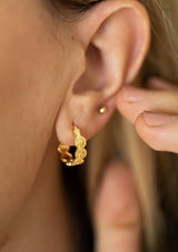 Cute hypoallergenic flower print hoop earrings, made with fourteen karat gold plated sterling silver base. Made in the USA.