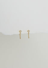 A delicate chain stud earring with a freshwater pearl accent. Made with fourteen karat gold plating on sterling silver. Hypoallergenic and made in the USA.