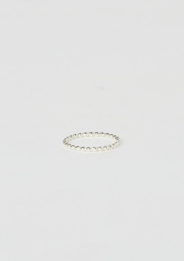[Color: Silver Pebble] A small pebbled stacking ring hand made from sterling silver.