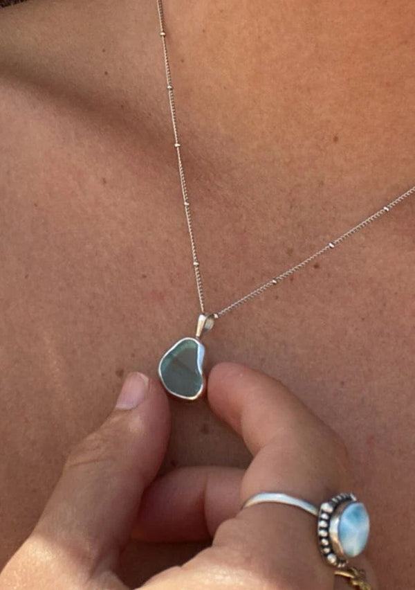 [Color: Green] A white gold plated sterling silver base necklace with a unique sea glass charm in green. 