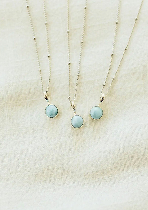 A white gold plated on sterling silver necklace with a unique larimar stone charm. Hypoallergenic and made in the USA!