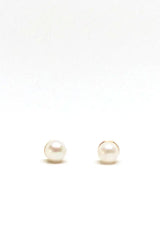 Classic pearl stud earrings, hypoallergenic and made in the USA.