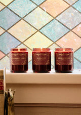 P.F. Candle in Silver Mist. A burgundy glass jar candle for the holidays.