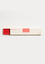 Incense box with red incense sticks on a white background