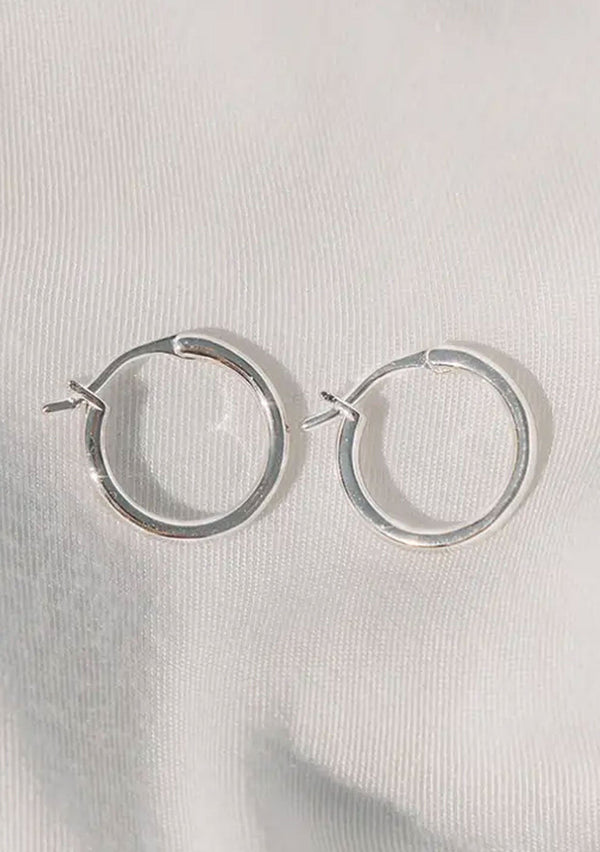 [Color: Silver] A classic silver colored hoop earring, made with hypoallergenic white gold plated sterling silver. 
