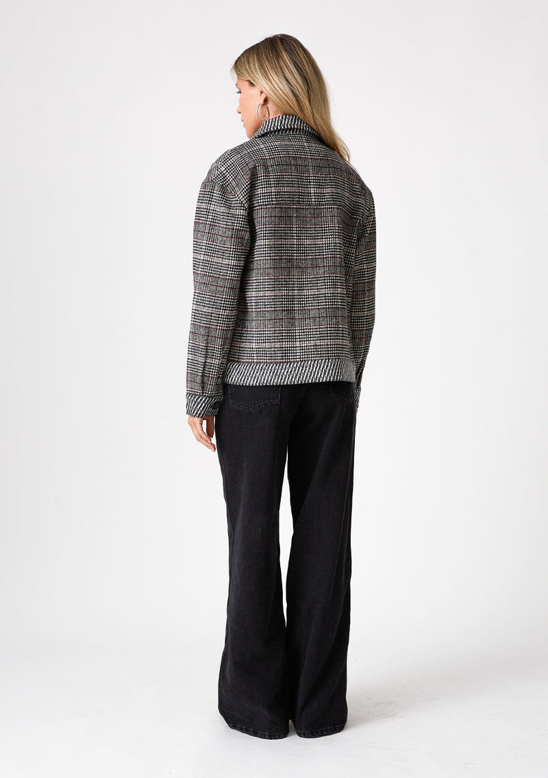[Color: Wine/Black] A back facing image of a blonde model wearing a classic bohemian shirt jacket in a black and red patchwork plaid. A fall shirt jacket with long sleeves, a button front, a collared neckline, front patch flap pockets, and side pockets. 
