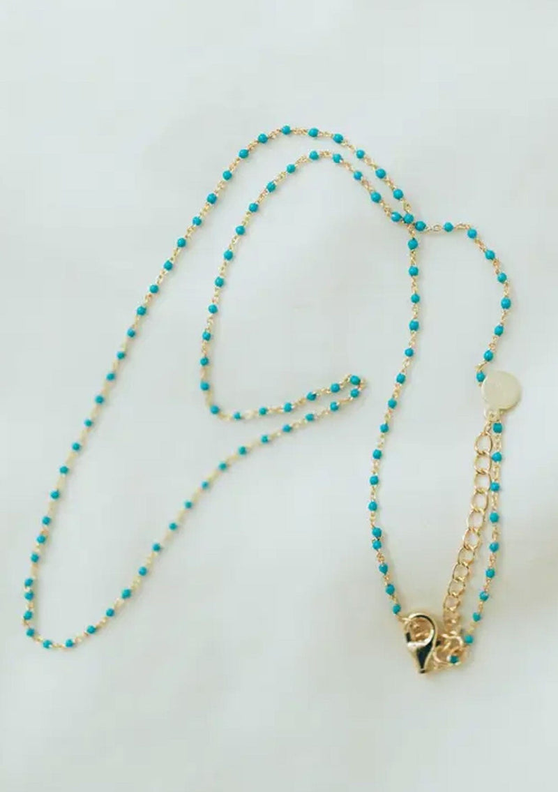 A fourteen karat gold plated on sterling silver necklace with turquoise enamel beads. Hypoallergenic and made in the USA. 