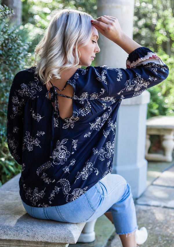 [Color: Midnight Rust] Bohemian floral print peasant blouse. Featuring flattering long voluminous sleeves, a loose, billowy fit, and a flirty open tie back detail.