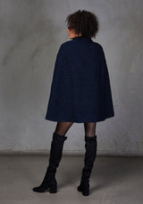 [Color: Navy] A double breasted cape coat. Featuring a chic flyaway silhouette and a soft marled texture. 