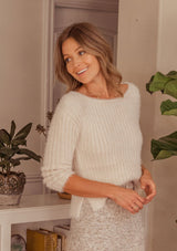 [Color: Blush] A soft sweater in a romantic fuzzy rib. Featuring an elegant boat neckline and side slits. 