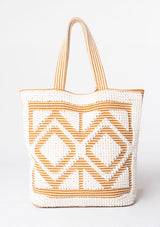 [Color: White/Saddle] An oversize white and brown bohemian carpet tote bag.