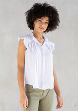 [Color: Chalk] A classic white bohemian top, designed in silky crepe. With short flutter cap sleeves and a self covered button front.