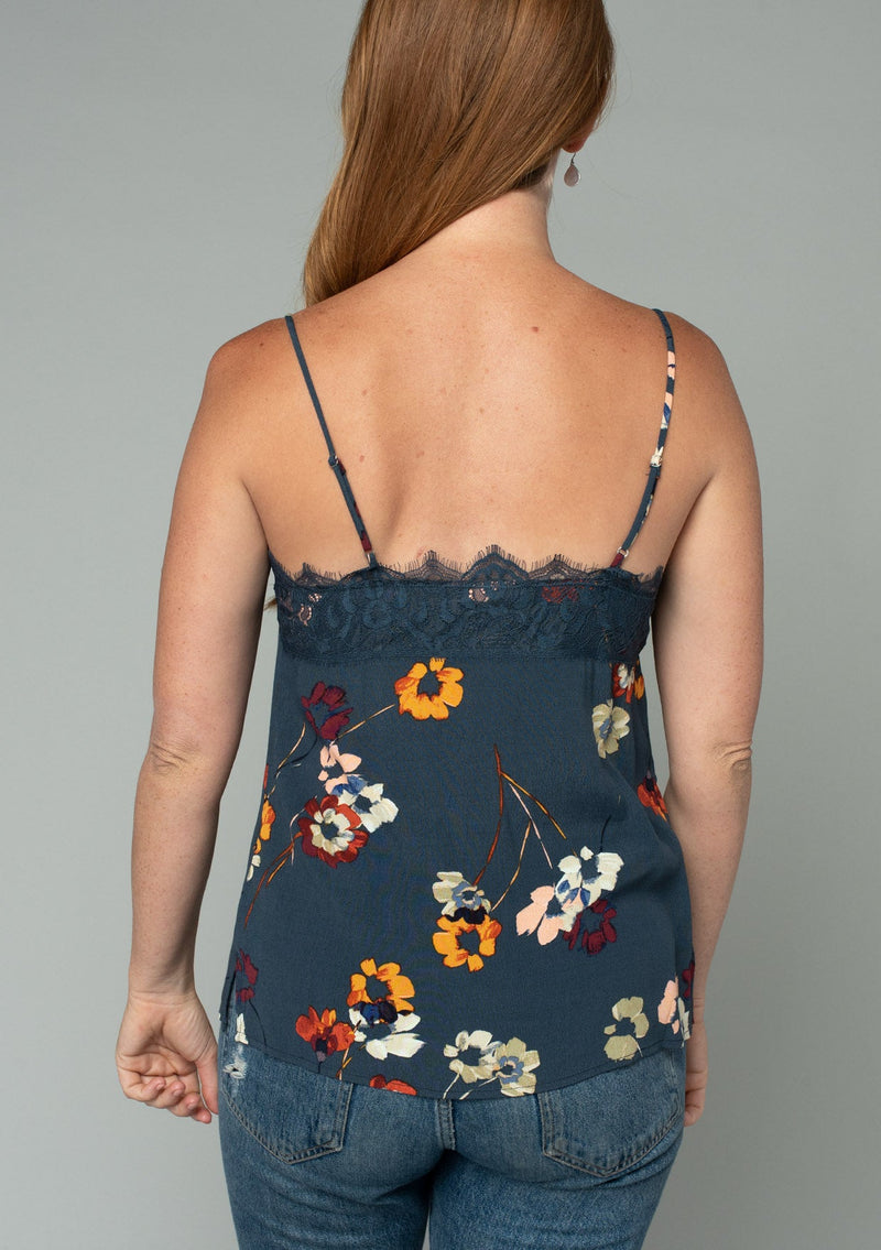 [Color: Grey/Wine] A back facing image of a red headed model wearing a sexy lace trim camisole tank top in a dark grey and red floral print. With adjustable spaghetti straps and a v neckline. 