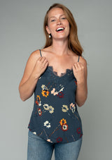 [Color: Grey/Wine] A half body front facing image of a red headed model wearing a sexy lace trim camisole tank top in a dark grey and red floral print. With adjustable spaghetti straps and a v neckline. 