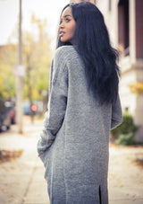 [Color: Heather Grey] A classic mid length cardigan. Featuring essential side pockets and contrast ribbed trim. 