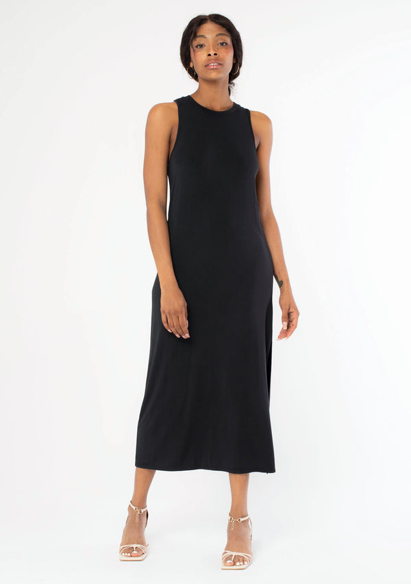 [Color: Black] A front facing image of a black model wearing a soft and stretchy sleeveless black maxi dress. With a round crew neckline, a sexy side slit, a racer back with a knot detail, and a relaxed fit.