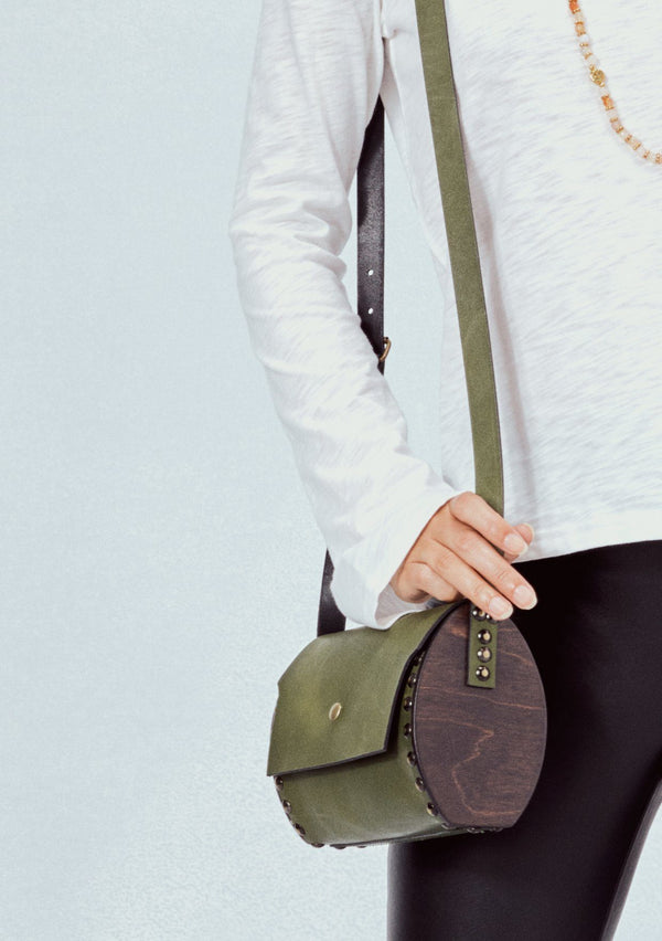 [Color: Olive] The ultimate bohemian crossbody bag. A unique purse in beautiful olive green, this barrel style bag features studded details and real wooden sides. 
