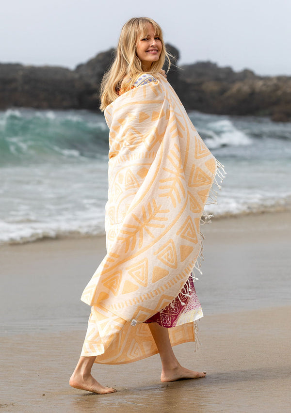 [Color: Yellow/Natural] A yellow patterned bohemian cotton beach blanket.