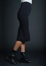 [Color: Black] Lovestitch black, fitted, micro ribbed pencil skirt features a high contoured waist and back slit detail.