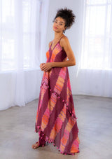 [Color: Wine/Pink] A model wearing a sheer cotton tie dye scarf dress. With a handkerchief hemline, front keyhole detail, and sexy adjustable strappy back.