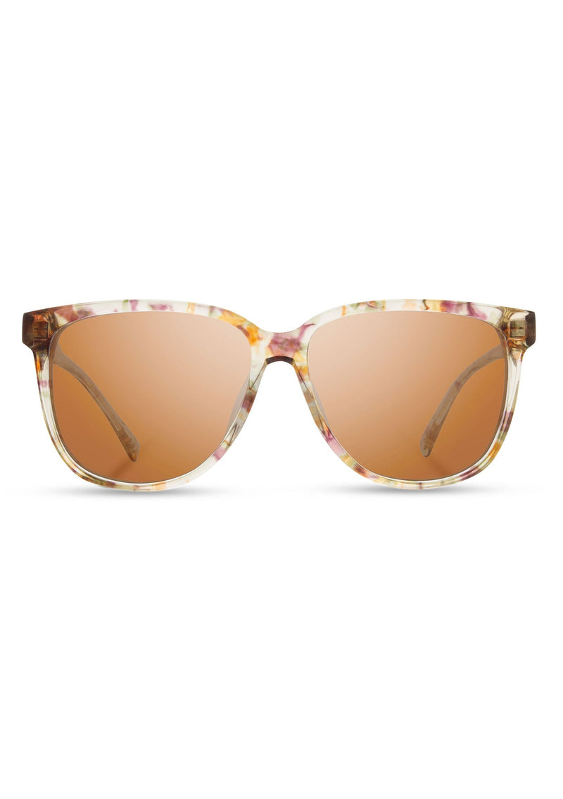 [Color: Blossom] Round, oversize acetate sunglasses with a rose flower inlay. 