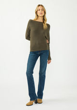 [Color: Olive] A front facing image of a blonde model wearing an olive pullover sweater with a boat neckline and long sleeves that taper at the cuffs. 