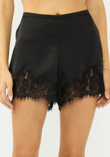 [Color: Black] A front facing image of black satin lace short. 