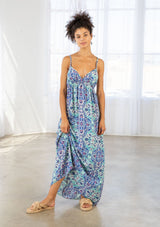 [Color: Blue/Mint] A front facing image of a brunette model wearing a blue bohemian printed maxi dress with spaghetti straps, a v neckline, and an empire waist. 