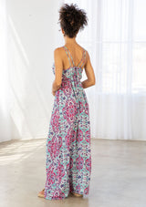 [Color: Coral/Mint] A back facing image of a brunette model wearing a pink and blue bohemian printed maxi dress with spaghetti straps, a v neckline, and an empire waist. 