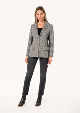 [Color: Cream/Black] A full body front facing image of a blonde model wearing a classic blazer in a grey patchwork plaid. With a button front, long sleeves, and side flap pockets. 