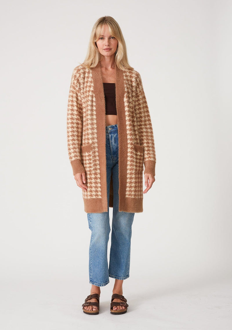 [Color: Taupe/Cream] A full body front facing image of a blonde model wearing a mid length fuzzy sweater coat in a brown and cream houndstooth plaid design. With long sleeves, an open front, and side patch pockets. 