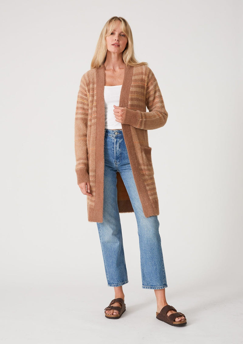[Color: Taupe/Mustard] A full body front facing image of a blonde model wearing a fuzzy sweater coat in a brown plaid design. With long sleeves, an open front, a mid length hemline, and side patch pockets. 