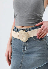 [Color: Natural] An off white boho elastic belt with a raffia buckle. 