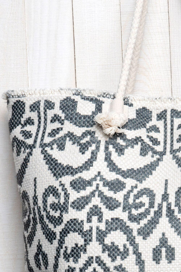[Color: Black/Vanilla] A detail image of an summer tote bag crafted in a durable woven design with an abstract pattern. Featuring double rope handles for easy carrying. 