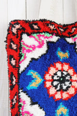 [Color: Blue/Red] A bohemian multicolor fuzzy tote bag with a canvas back.