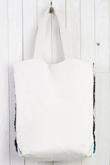 [Color: Red/Teal] A bohemian multicolor fuzzy tote bag with a canvas back.