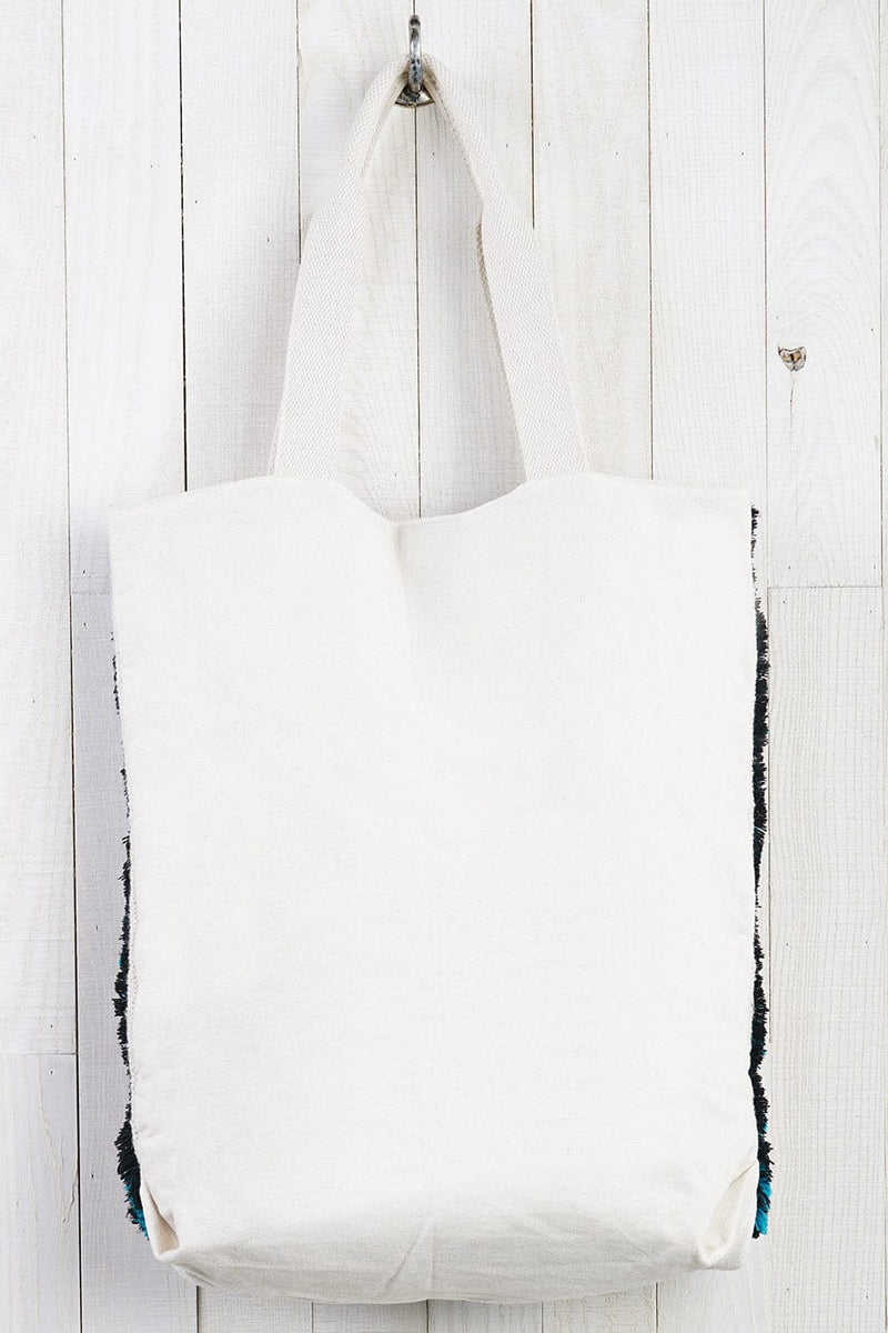 [Color: Red/Teal] A bohemian multicolor fuzzy tote bag with a canvas back.