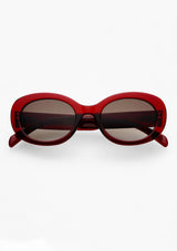 [Color: Dark Cherry] An image of round sunglasses with a red frame from FREYRS.