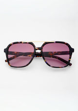 [Color: Lavender] Sunglasses with tortoiseshell frame and purple lenses on a white background