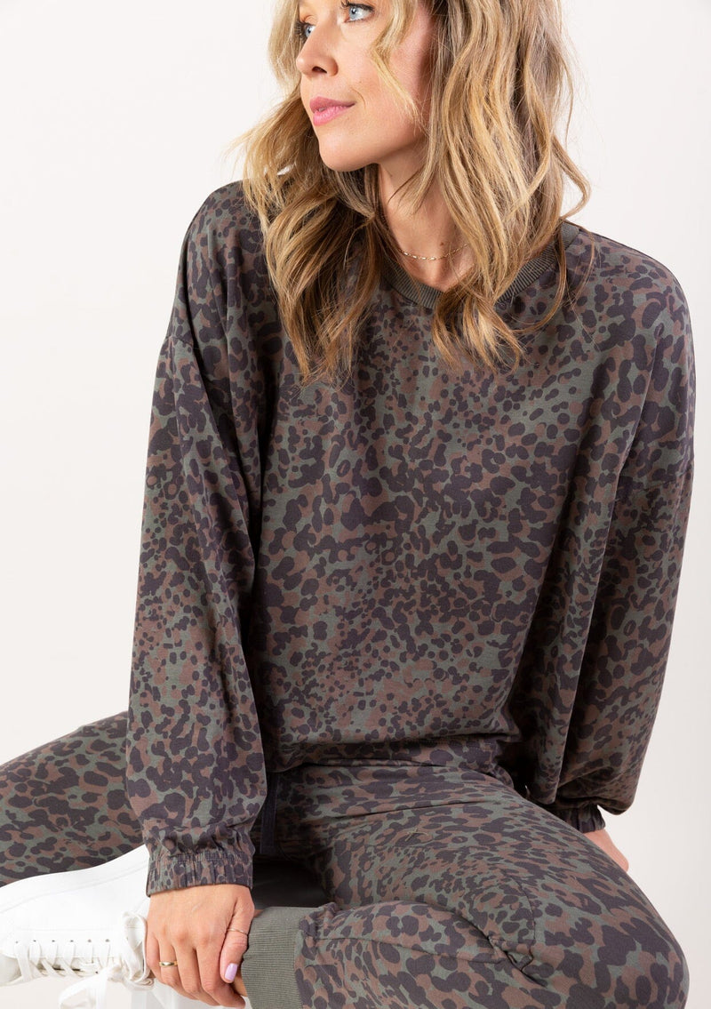[Color: Charcoal Combo] A soft pullover sweatshirt in a grey animal print. 