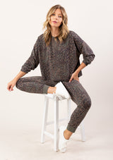 [Color: Charcoal Combo] A soft pullover sweatshirt in a grey animal print. 