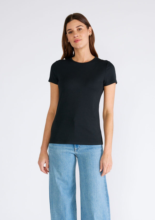 [Color: Black] A front facing image of a brunette model wearing a classic black slim fit tee shirt with a crew neckline and short sleeves, crafted from a ribbed knit. 