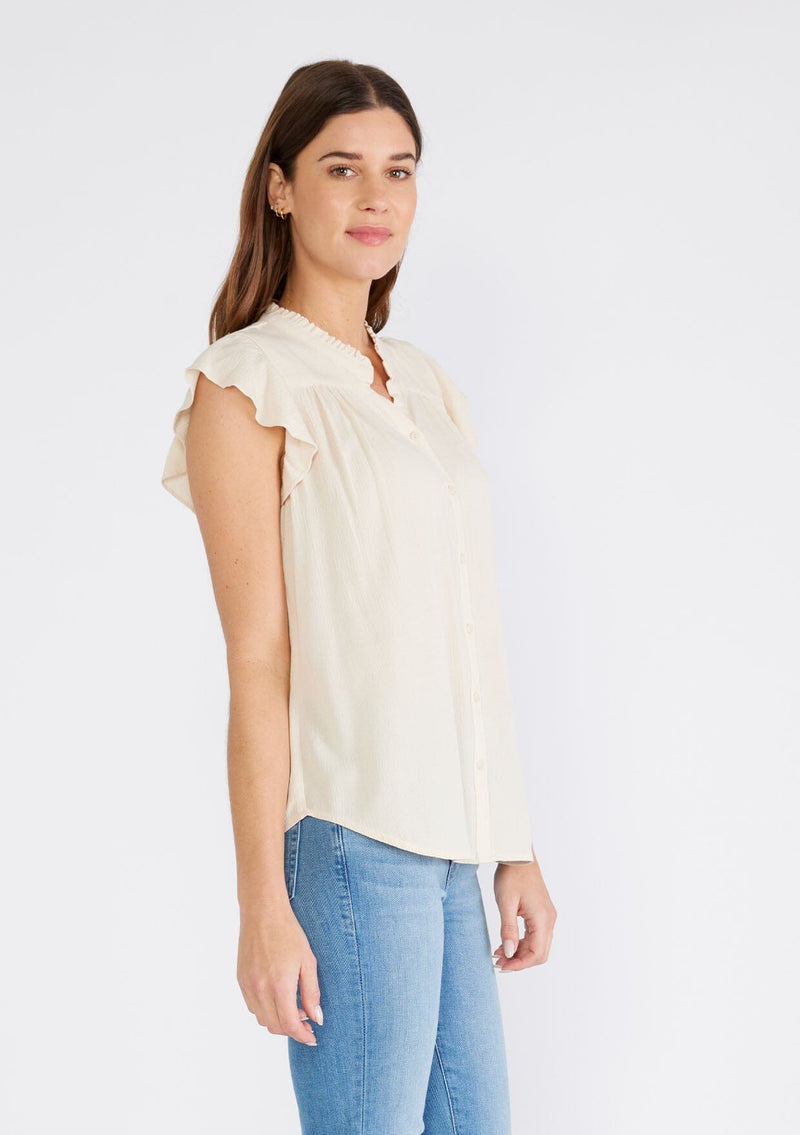 [Color: Natural] A side facing image of a brunette model wearing an off white crinkle gauze short sleeve flutter top with a button front and a ruffled neckline.